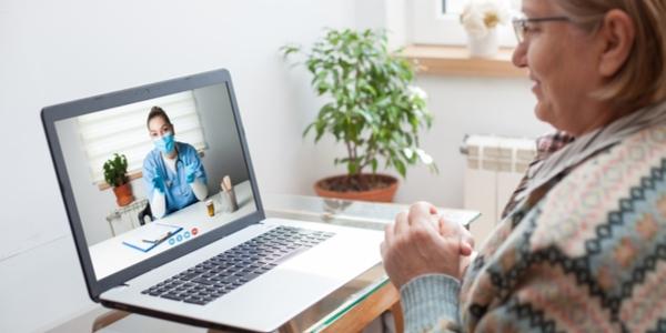 woman using telehealth with doctor