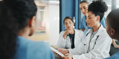 doctors looking at tablet