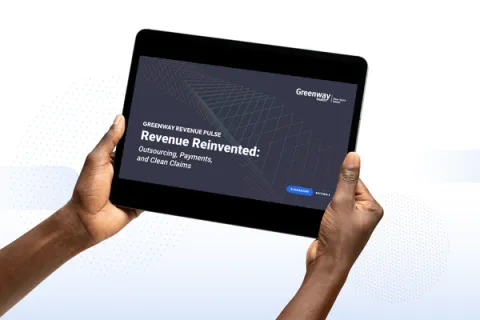 hands holding a tablet with the cover of the Revenue Pulse e-magazine
