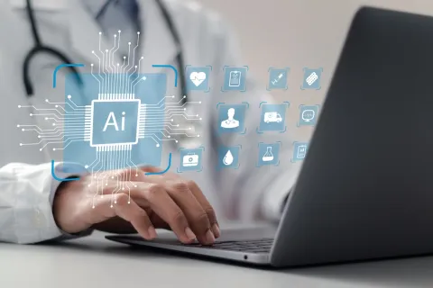 laptop with doctor typing, icons of healthcare and AI are floating above their hands
